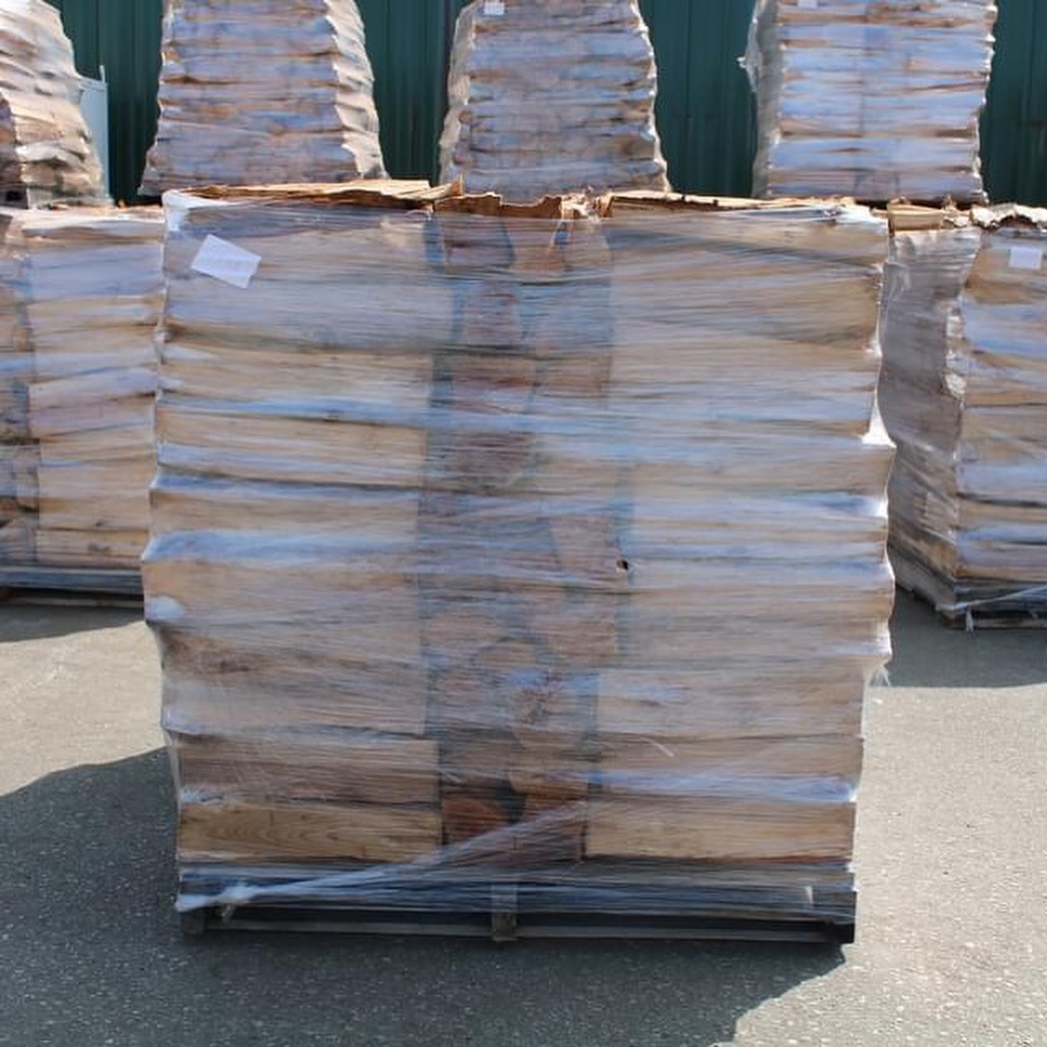 Softwood firewood logs shrink-wrapped on pallet for export