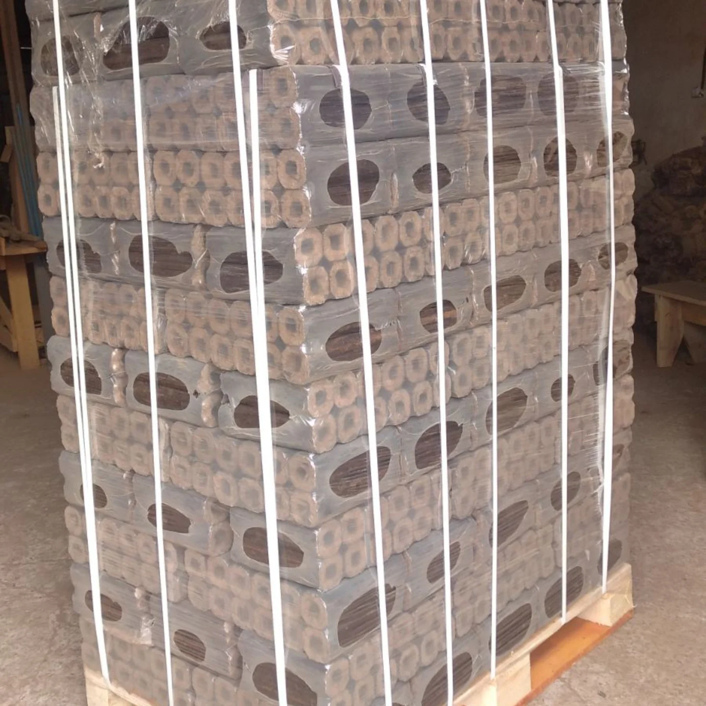 Pini and Kay hexagonal wood briquettes stacked for shipment