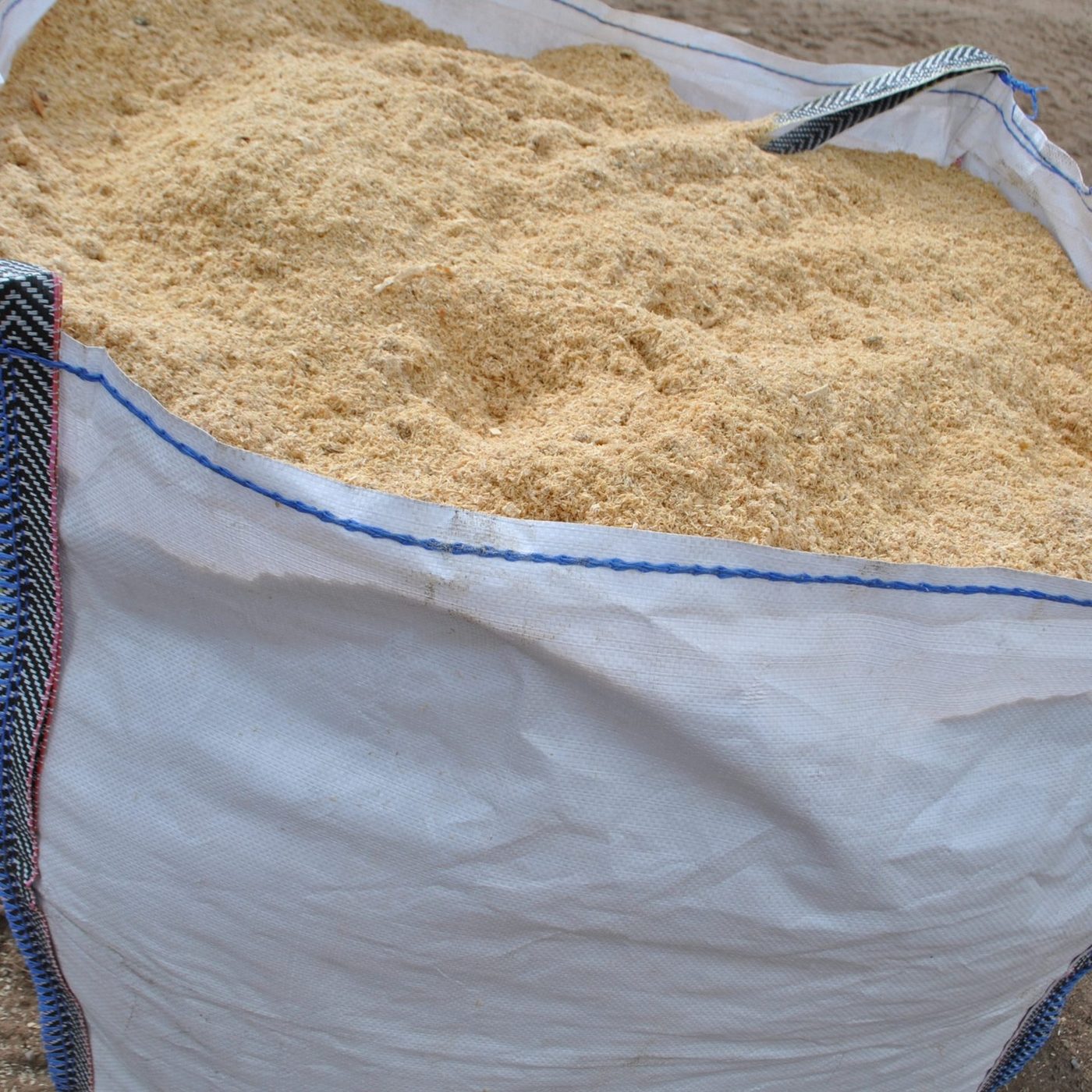 Fine wood dust in big bag, industrial supply for particleboard production